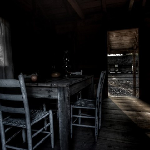 a chair sitting in front of a wooden table