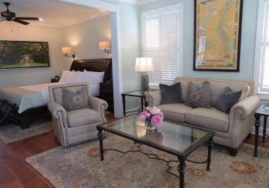 a living room filled with furniture and a fire place