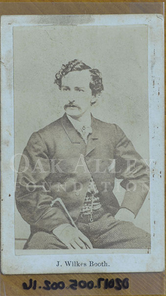 a vintage photo of a person holding a book