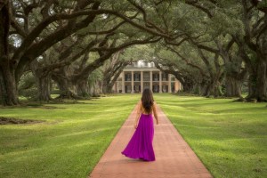 a young girl flying a kite in a park