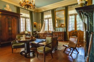 a living room filled with furniture and a fireplace