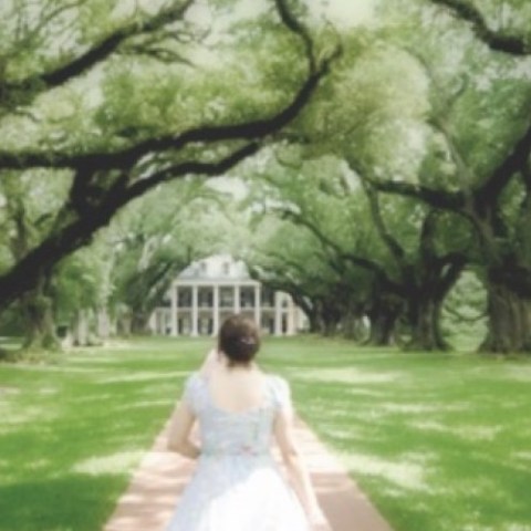 a person standing next to a tree