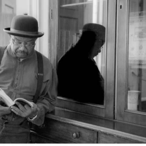 a man standing in front of a window