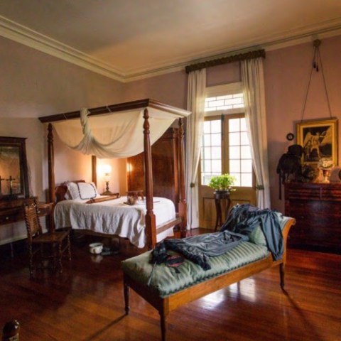 a living room filled with furniture and a large window